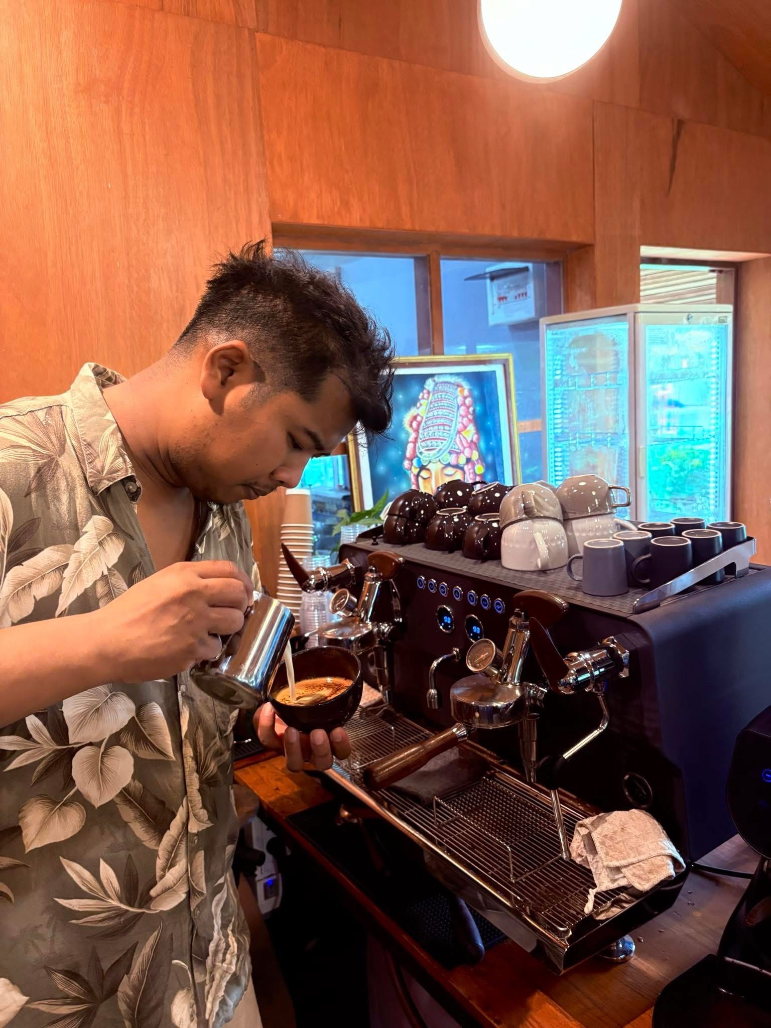 Pouring milk into coffee